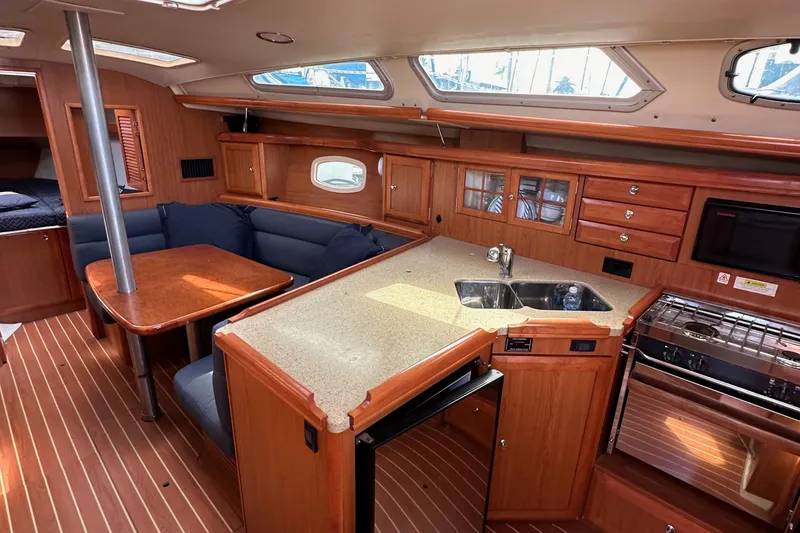 Slide: The Image of Interior of 2008 Hunter 36 sailboat with kitchen and dining area. - 64