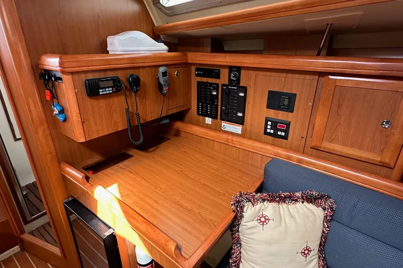 Slide: The Image of 2008 Hunter 36 yacht interior with navigation station and communication equipment. - 67
