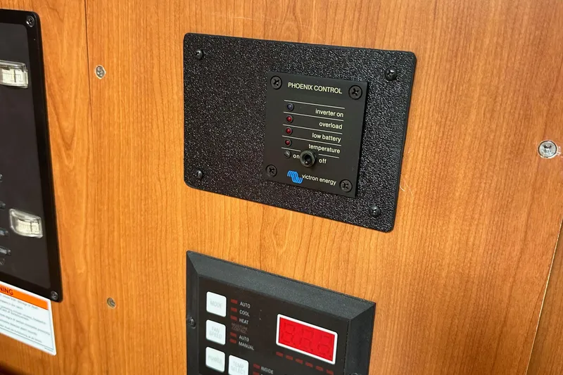 Slide: The Image of Control panel on a 2008 Hunter 36 boat with Victron Energy display. - 72