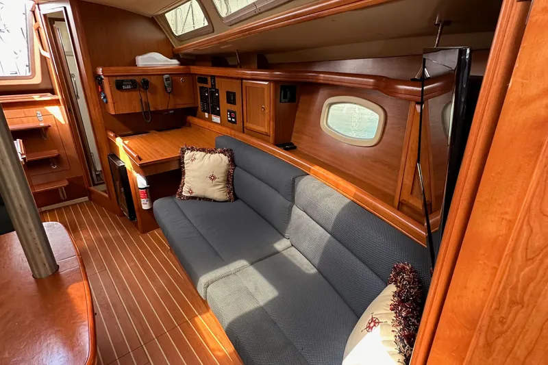 Slide: The Image of Interior of 2008 Hunter 36 sailboat with wood finish and cozy seating area. - 80