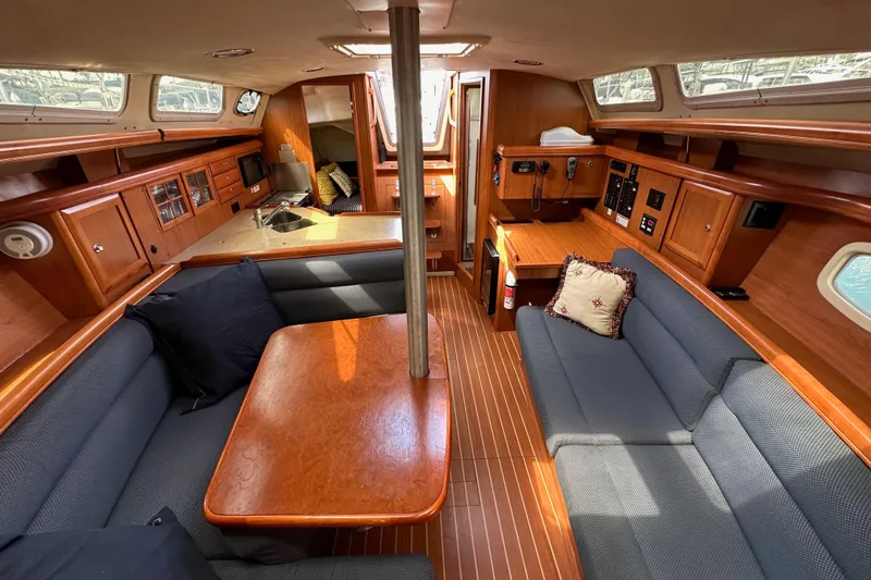 Slide: The Image of Luxurious interior of 2008 Hunter 36 sailboat with wood finish and cozy seating. - 82