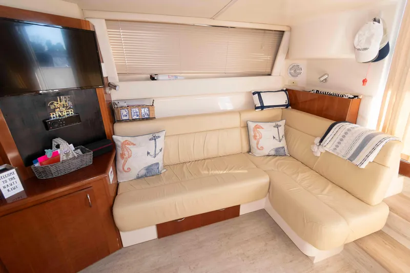 Slide: The Image of Interior of 2003 Carver 350 Mariner yacht with beige seating and nautical decor. - 15