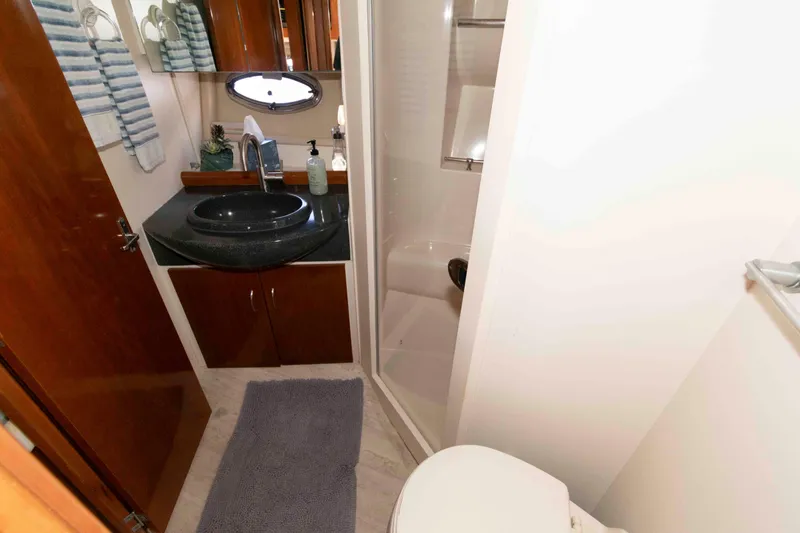 Slide: The Image of Bathroom interior of 2003 Carver 350 Mariner yacht with sink, shower, and toilet. - 20