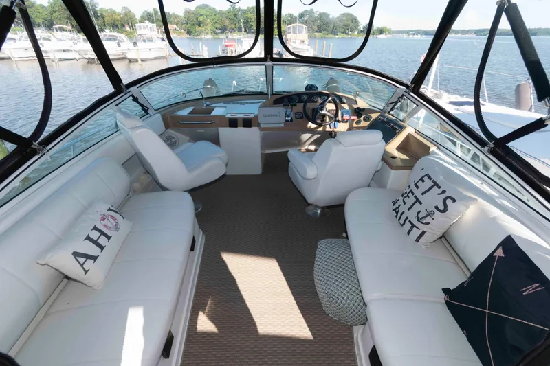 Slide: The Image of Luxurious interior of 2003 Carver 350 Mariner yacht with plush seating and scenic water view. - 4