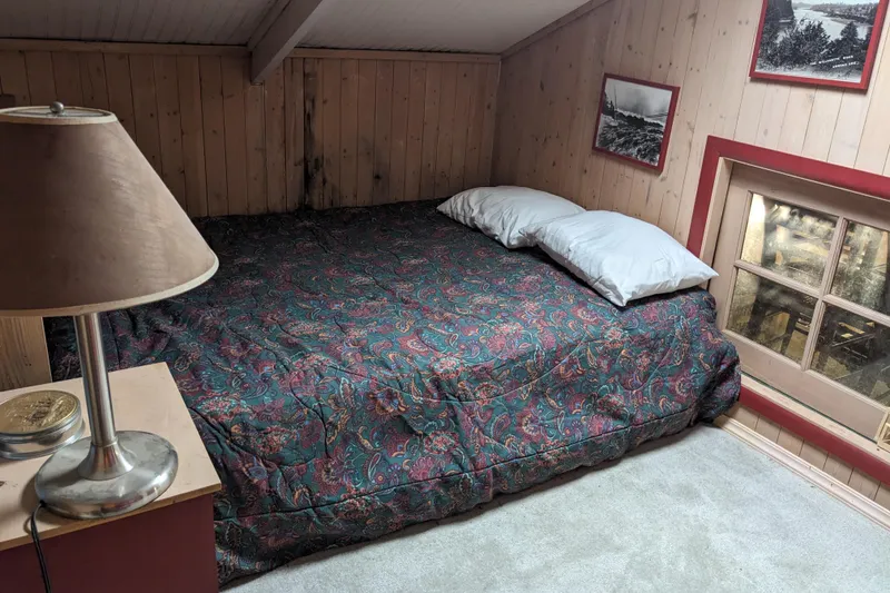 Slide: The Image of Cozy kitchen with green cabinets, elephant wall decor, and appliances near a window and door. - 17