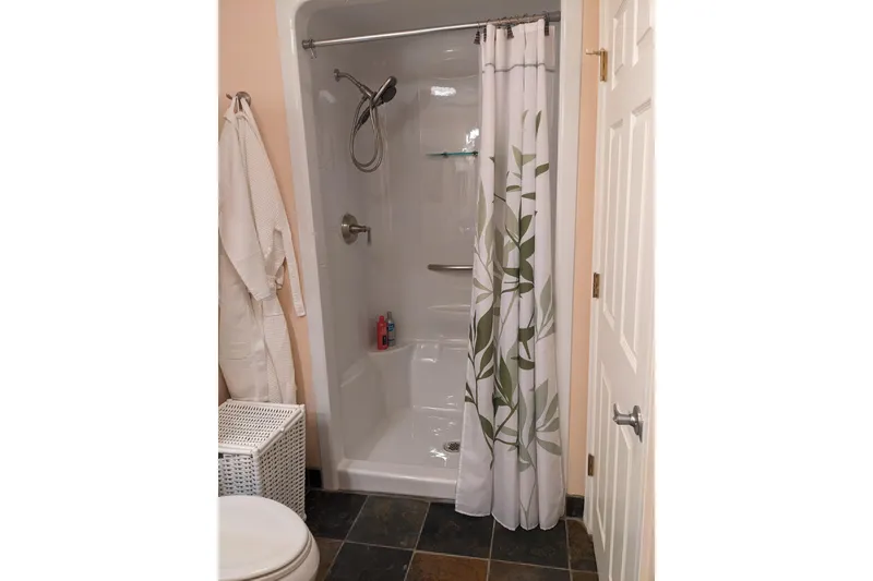 Slide: The Image of Cozy bathroom with tiled sink, wall art, and neatly arranged towels. - 20