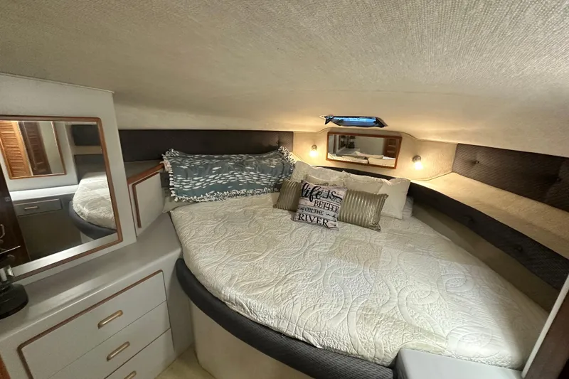 Slide: The Image of Cozy bedroom in 1990 Sea Ray 380 Aft Cabin yacht with elegant bedding and decor. - 54
