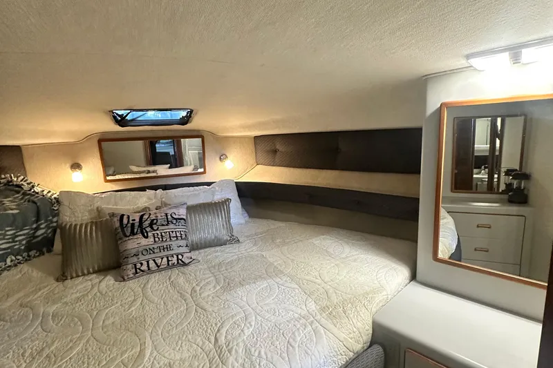 Slide: The Image of Cozy bedroom in 1990 Sea Ray 380 Aft Cabin with decorative pillows and mirrors. - 57