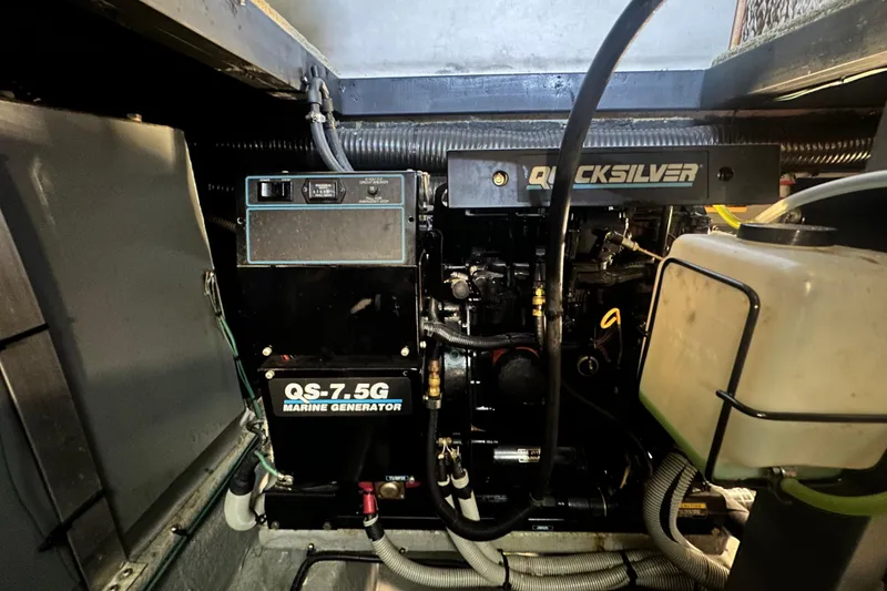 Slide: The Image of Engine room of a 1990 Sea Ray 380 Aft Cabin with Quicksilver marine generator. - 66