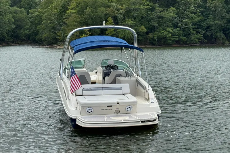 Slide: The Image of 2009 Sea Ray 280 Sundeck boat with blue canopy on a lake. - 6
