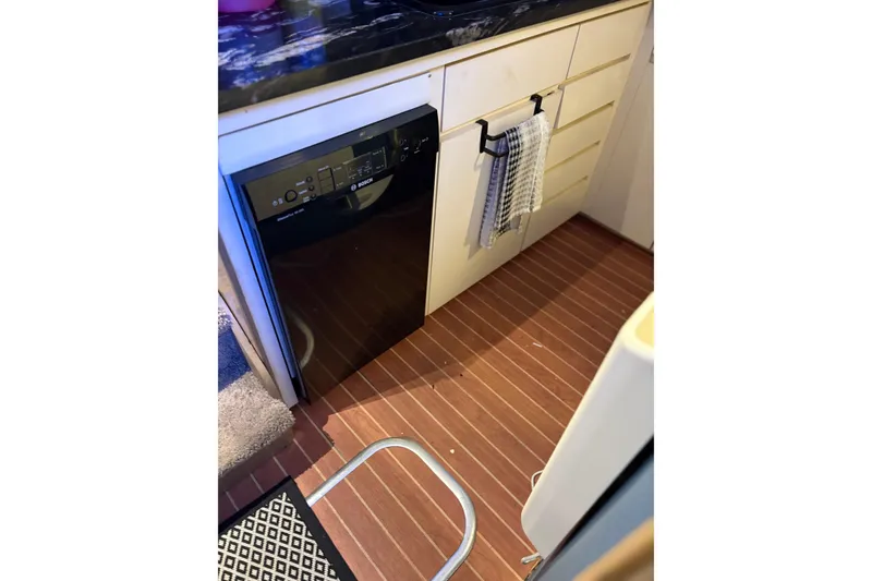 Slide: The Image of Kitchen area of 1991 Hatteras 52 Cockpit Motor Yacht with Bosch dishwasher. - 19