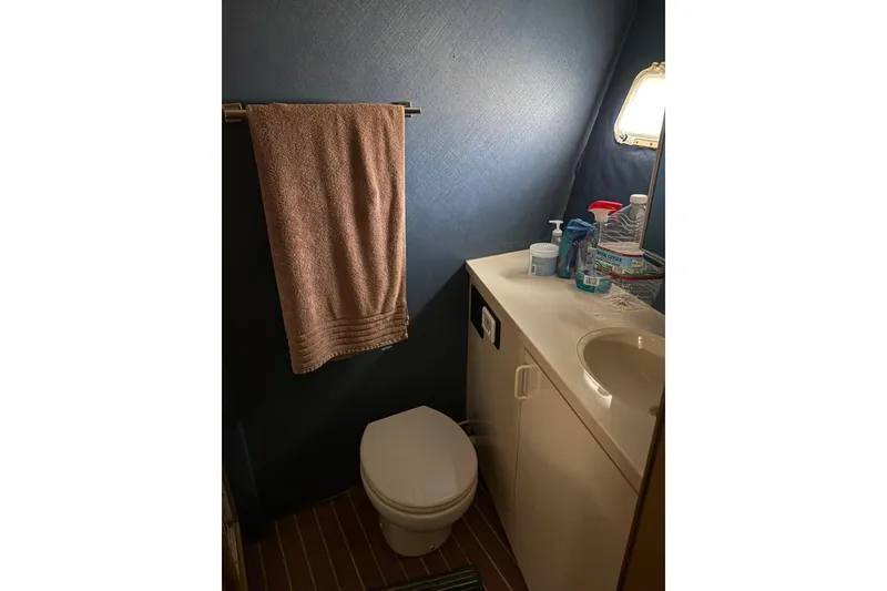 Slide: The Image of Bathroom interior of 1991 Hatteras 52 Cockpit Motor Yacht with towel and toiletries. - 22