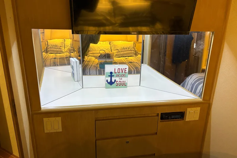 Slide: The Image of Interior of 1991 Hatteras 52 Cockpit Motor Yacht with cozy cabin decor. - 25