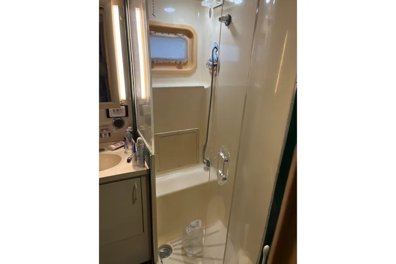Slide: The Image of Bathroom interior of 1991 Hatteras 52 Cockpit Motor Yacht with shower and sink. - 27