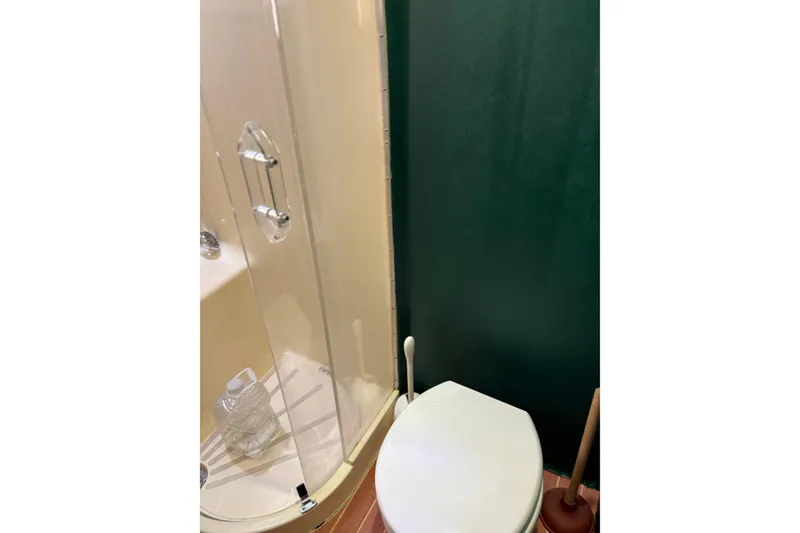 Slide: The Image of Bathroom interior of 1991 Hatteras 52 Cockpit Motor Yacht with shower and toilet. - 29