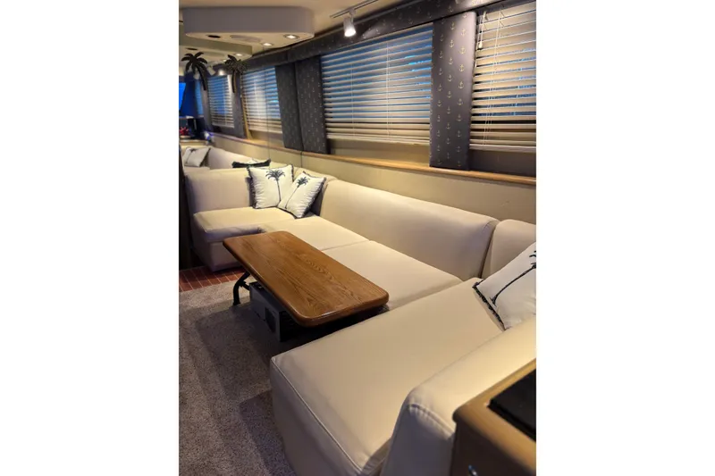 Slide: The Image of Luxurious interior of 1991 Hatteras 52 Cockpit Motor Yacht with plush seating and elegant decor. - 31