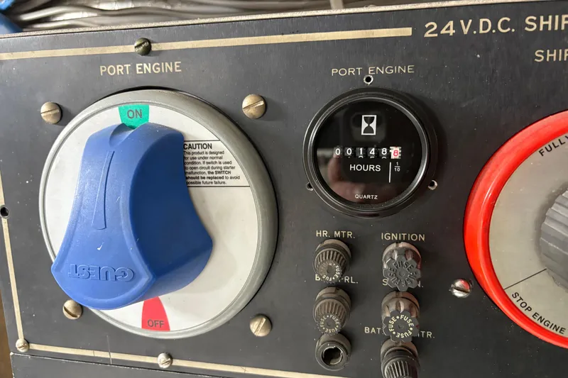 Slide: The Image of Control panel of a 1991 Hatteras 52 Cockpit Motor Yacht, showing port engine settings. - 34