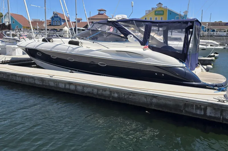 The Image of 2001 Sunseeker Camargue 44 yacht cruising near marina at sunset. - 0