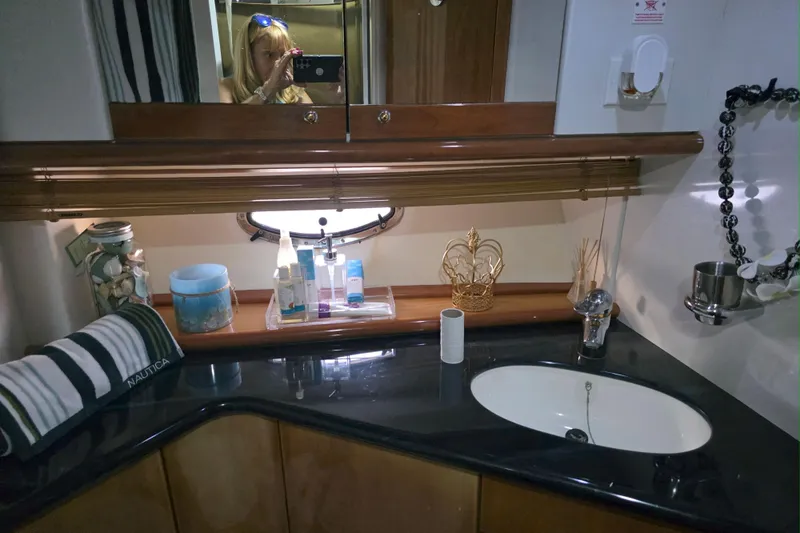 Slide: The Image of Luxurious cabin interior of 2001 Sunseeker Camargue 44 yacht with nautical-themed bedding. - 11