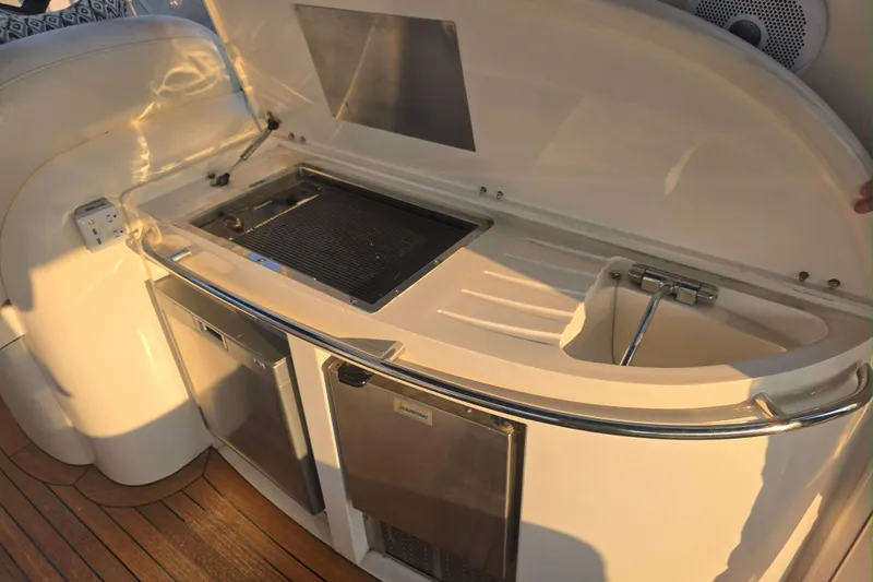 Slide: The Image of Luxurious interior of 2001 Sunseeker Camargue 44 yacht with elegant seating and wooden flooring. - 4