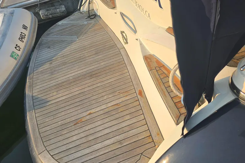 Slide: The Image of Sunseeker Camargue 44 yacht, 2001 model, docked in Newport Beach, CA, with cushioned seating. - 6