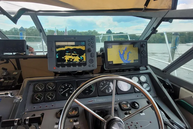 Slide: The Image of Cockpit of 1989 Cruisers 3670 with navigation screens and steering wheel. - 8