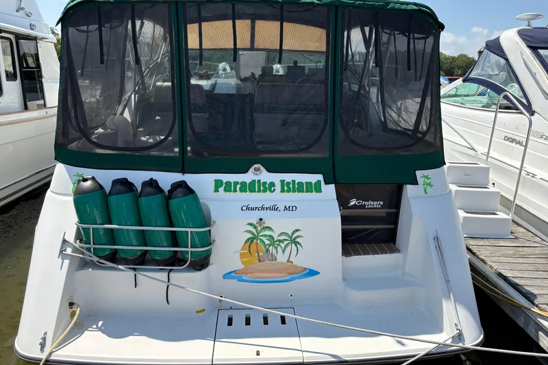 Slide: The Image of 1989 Cruisers 3670 yacht named "Paradise Island" docked in Churchville, MD. - 2