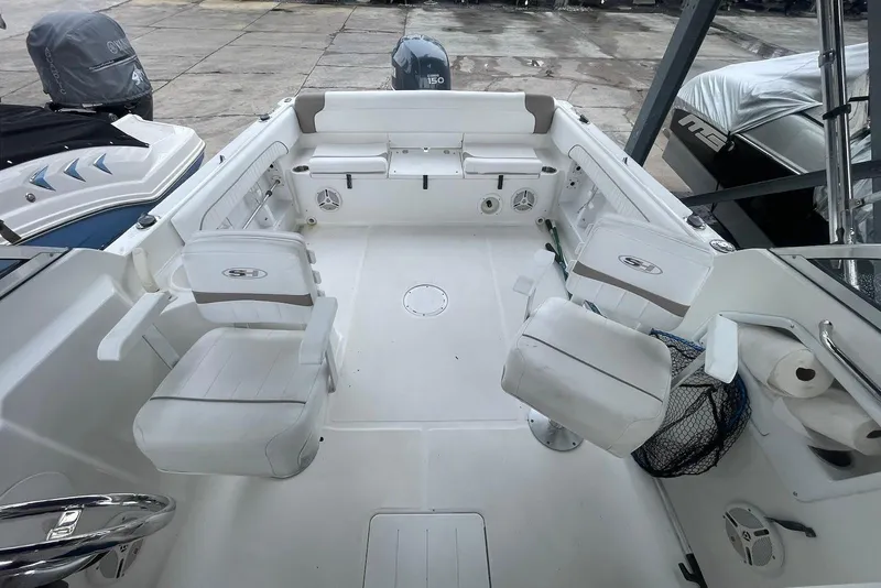 Slide: The Image of 2009 Sea Hunt Escape 220 LE boat interior with seating and storage compartments. - 4