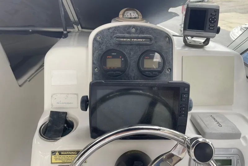 Slide: The Image of 2009 Sea Hunt Escape 220 LE dashboard with Garmin GPS and Yamaha gauges. - 6