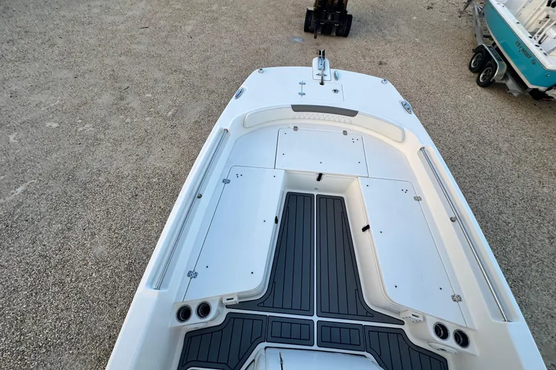 Slide: The Image of 2022 World Cat 235 CC boat deck, featuring spacious storage and sleek design. - 10