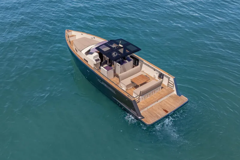 Slide: The Image of 2021 Fjord 40 Open yacht cruising on clear blue water, showcasing sleek design and spacious deck. - 1