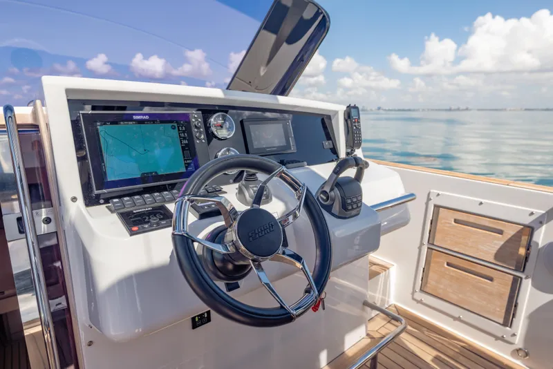 Slide: The Image of Helm of 2021 Fjord 40 Open yacht with navigation equipment and steering wheel. - 10
