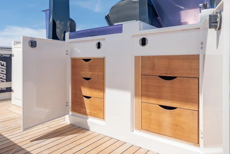 Slide: The Image of Wooden storage drawers on a 2021 Fjord 40 Open yacht deck. - 15