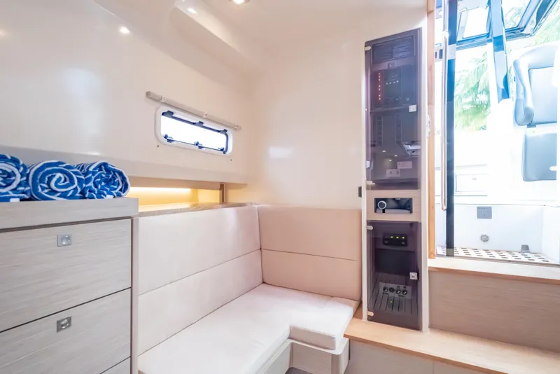 Slide: The Image of Interior of 2021 Fjord 40 Open yacht, featuring modern seating and control panel. - 18