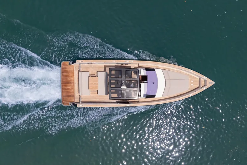 Slide: The Image of Aerial view of 2021 Fjord 40 Open yacht cruising on water. - 2