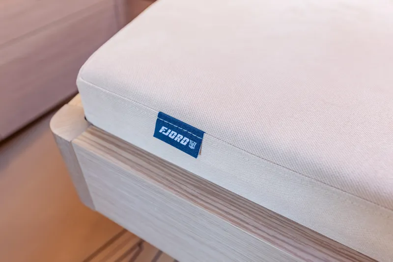 Slide: The Image of Cushion detail on 2021 Fjord 40 Open yacht, featuring a blue Fjord label. - 22