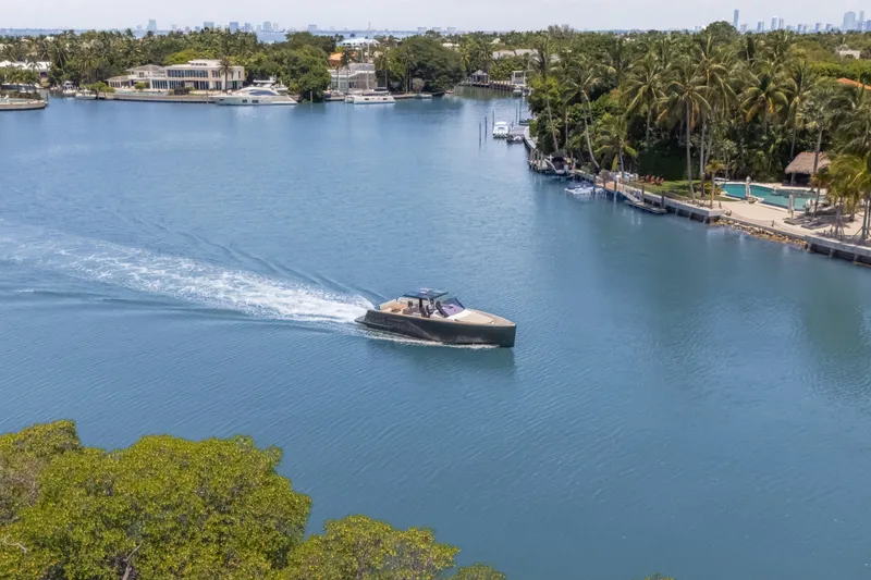 Slide: The Image of 2021 Fjord 40 Open yacht cruising on a scenic, tropical waterway. - 6