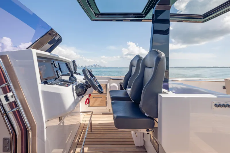 Slide: The Image of 2021 Fjord 40 Open yacht cockpit with modern controls and ocean view. - 9