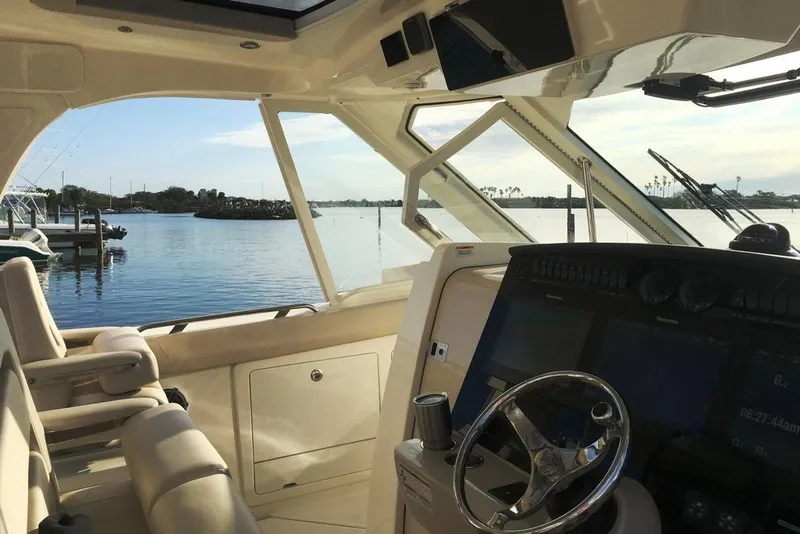 Slide: The Image of Manufacturer Provided Image: Interior view of 2019 Boston Whaler 380 Realm boat with scenic water backdrop. - 12
