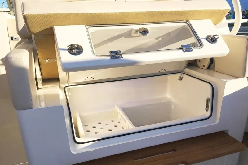 Slide: The Image of Manufacturer Provided Image: Open storage compartment on a 2019 Boston Whaler 380 Realm boat. - 14