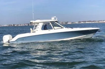 Slide: The Image of 2019 Boston Whaler 380 Realm boat cruising on open water. - 6