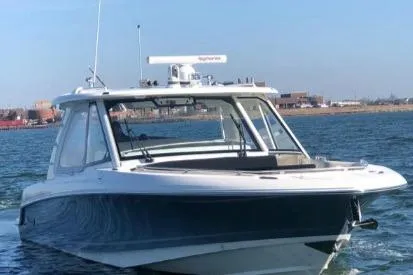 Slide: The Image of 2019 Boston Whaler 380 Realm boat cruising on open water. - 8