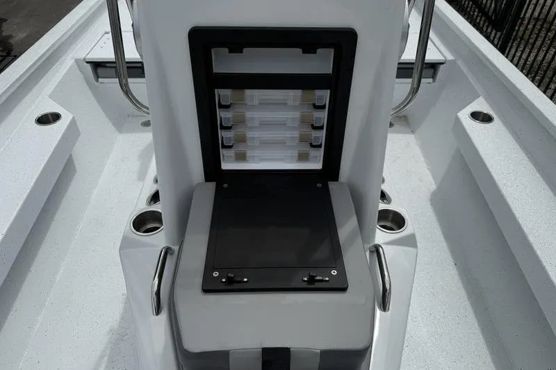 Slide: The Image of 2026 Xpress H22B boat interior with storage compartments and cup holders. - 10