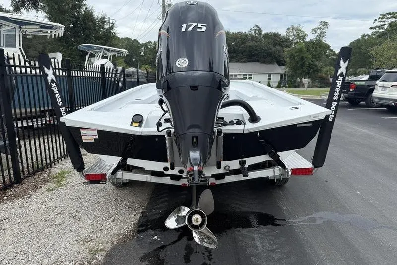 Slide: The Image of 2026 Xpress H22B boat with 175 horsepower engine, parked on a trailer. - 5