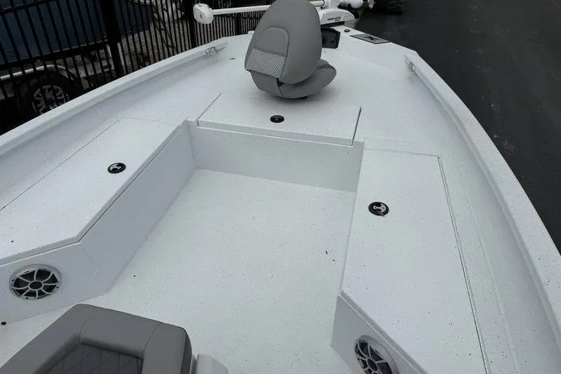 Slide: The Image of 2026 Xpress H22B boat deck with seating and storage compartments. - 7