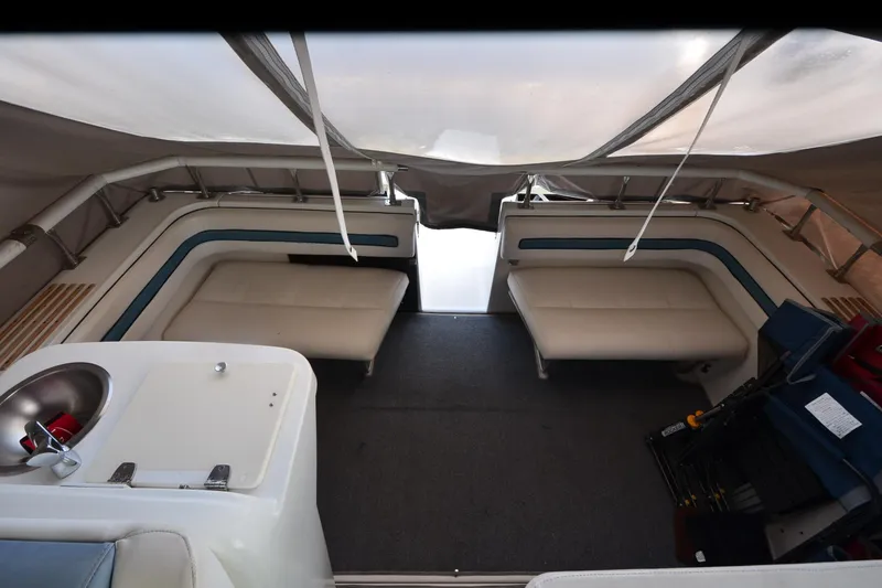 Slide: The Image of Interior of 1990 Slick Craft 310 SC boat with seating and sink. - 12