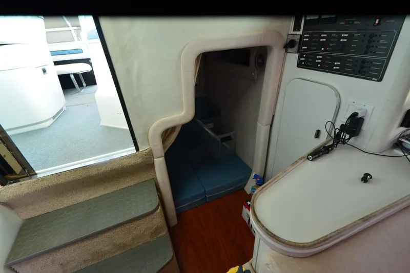 Slide: The Image of Interior of 1990 Slick Craft 310 SC boat with steps and control panel. - 20