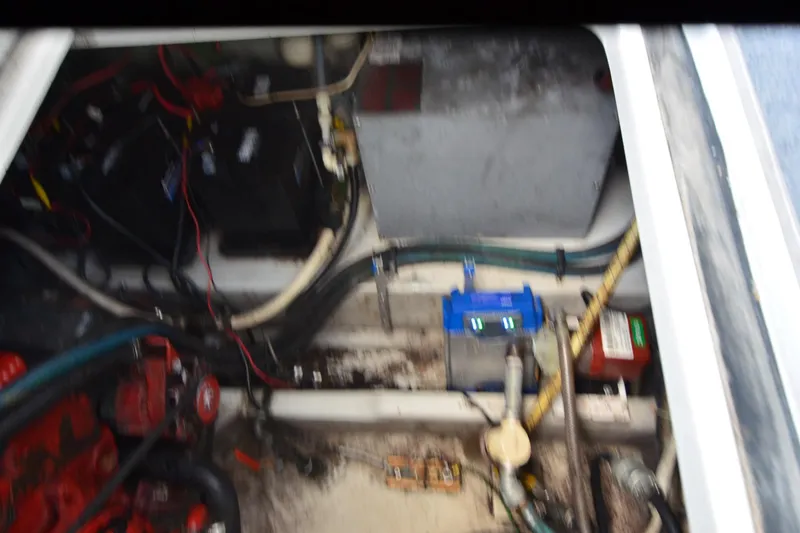 Slide: The Image of Engine compartment of a 1990 Slick Craft 310 SC boat, showing wiring and components. - 26