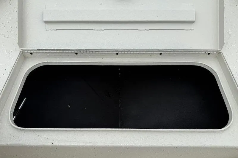 Slide: The Image of Open storage compartment in 2026 Xpress H22B boat, showcasing spacious interior. - 10