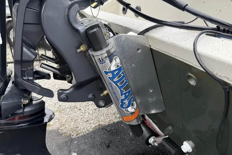 Slide: The Image of 2026 Xpress H22B boat with Atlas hydraulic jack plate, close-up view. - 20